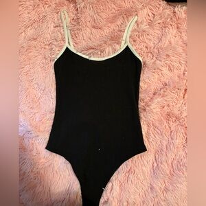 Black and white lined bodysuit from Forever 21. Size XS.
